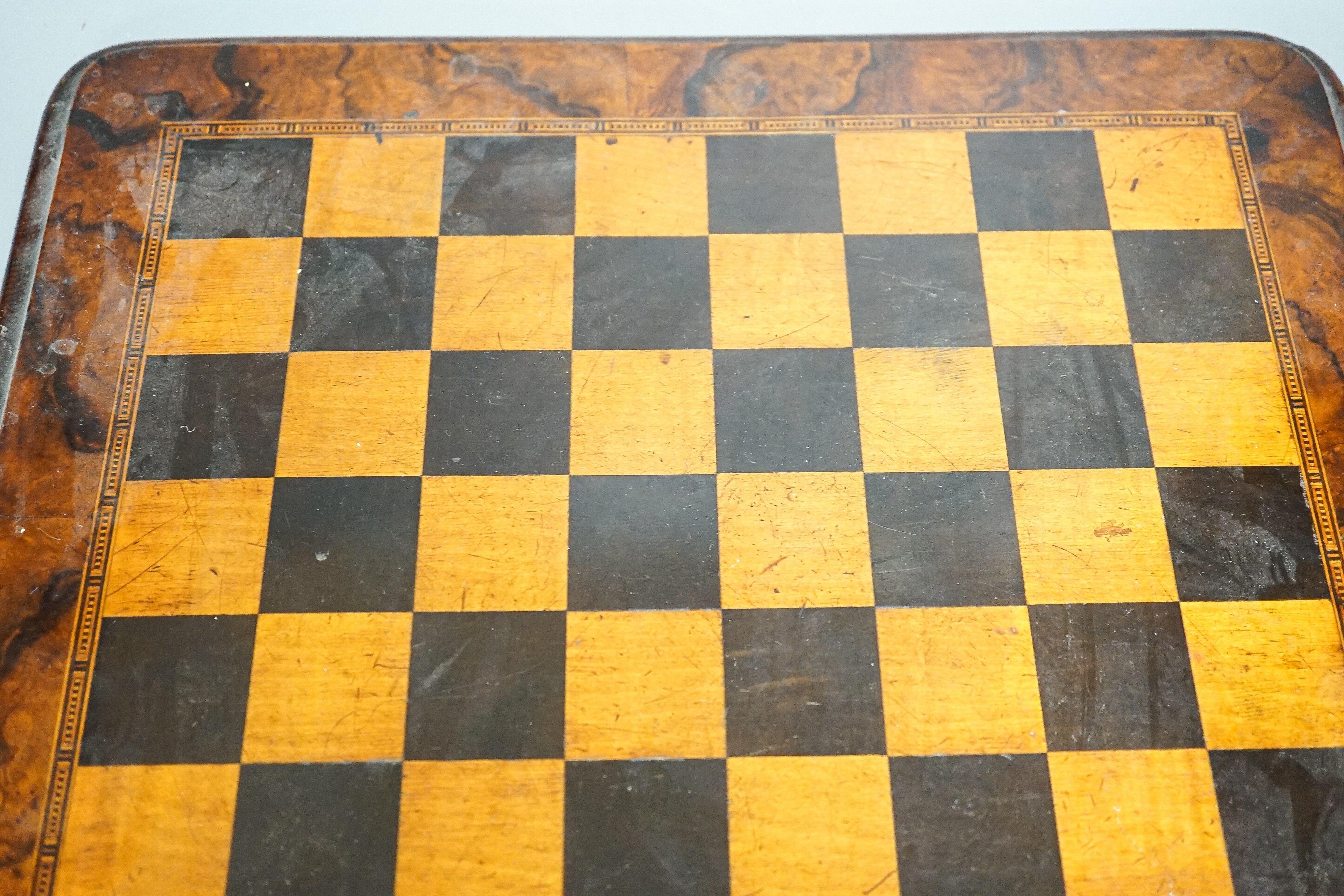 A late 19th century walnut, ebony and sycamore chessboard together with a box set of dominoes, chessboard 41cm x41cm